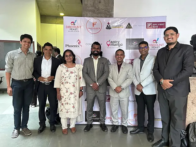 Speakers and partners at the sponsor wall